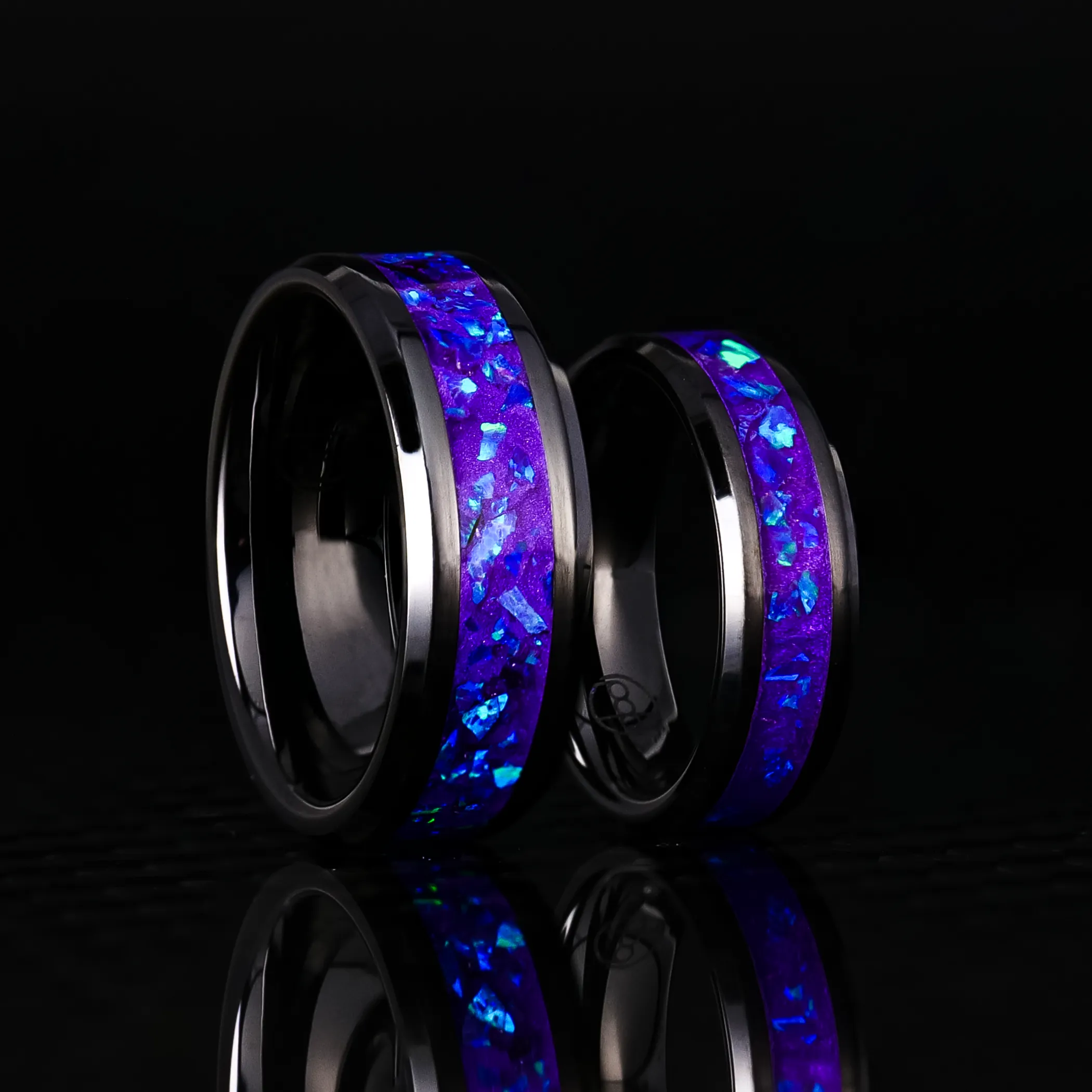 Matching Lavender Opal Glowstone Wedding Ring Set on Black Ceramic